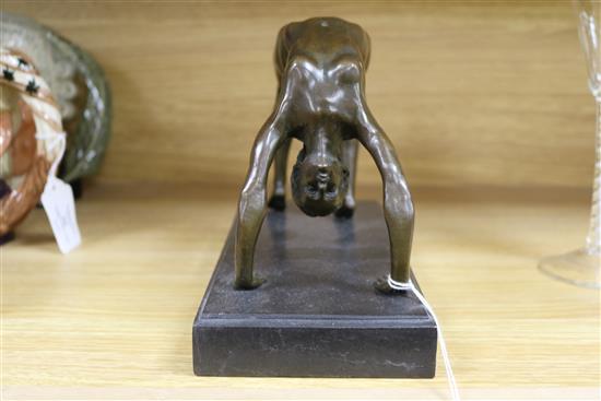 A bronze figure of an acrobat, signed Milo length 25cm